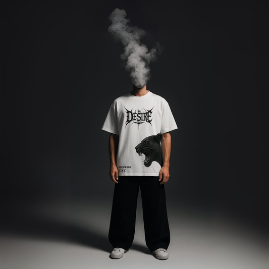 Person wearing a white t-shirt with a graphic design and text, standing against a dark background.